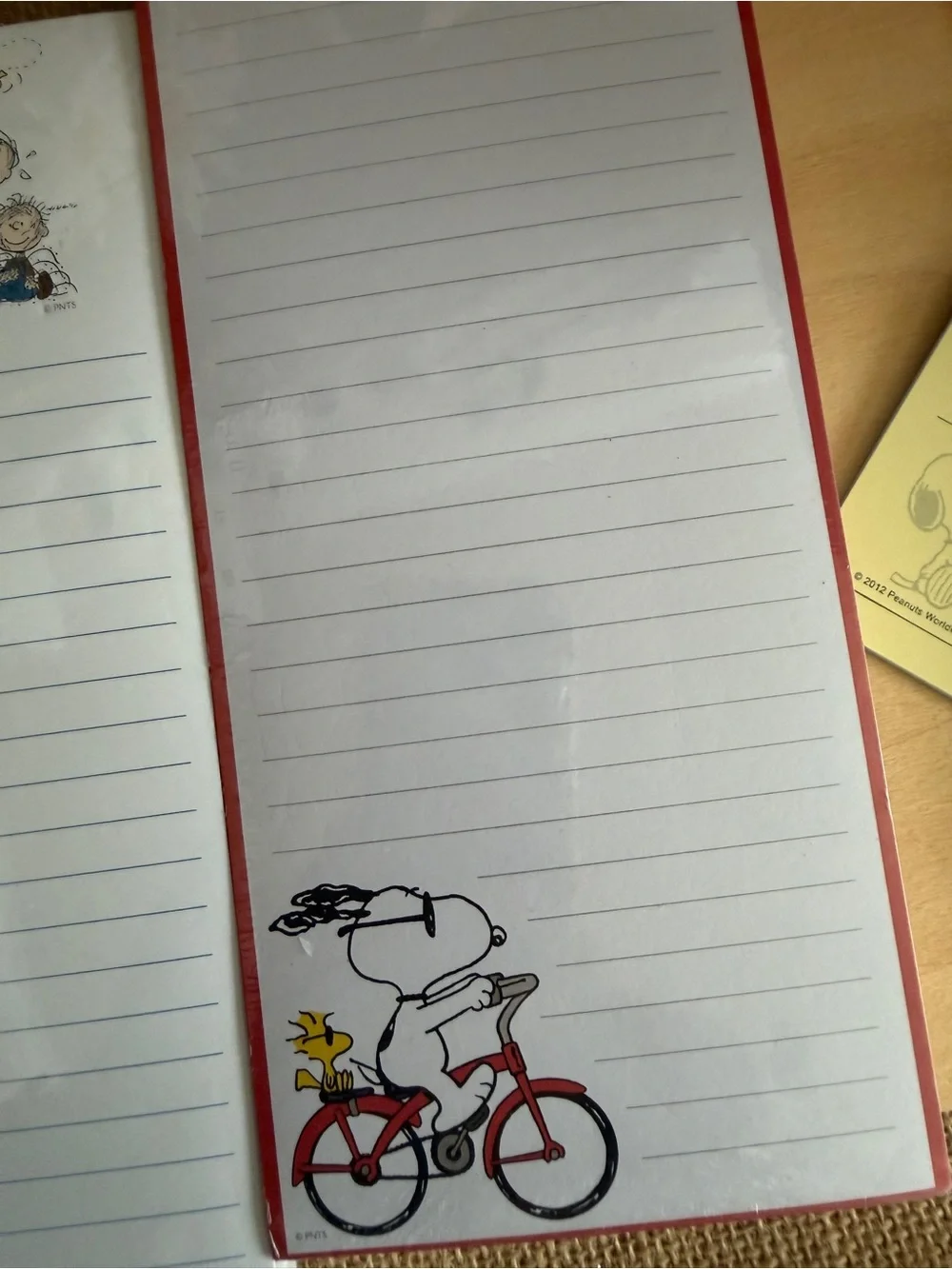 Peanuts White & Red Lined Notebook with Snoopy Bike Illustration